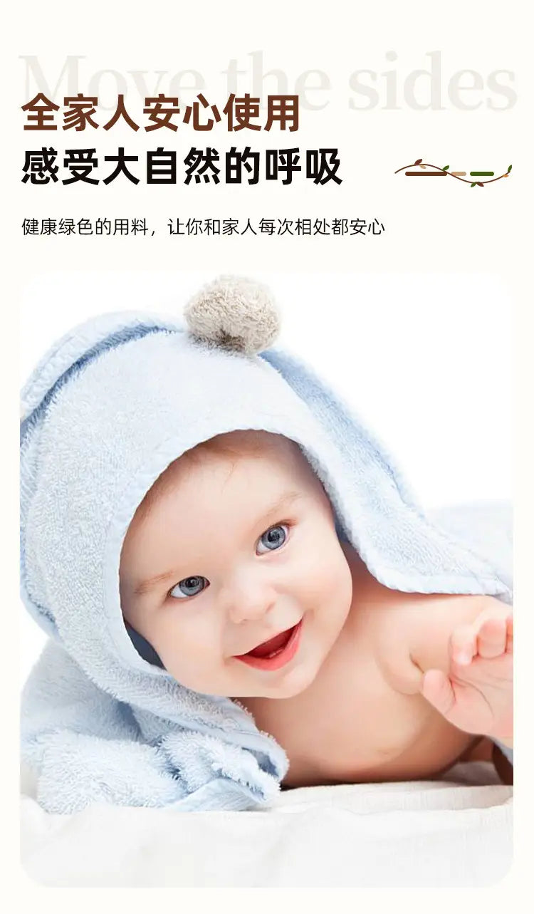light blue plush hooded towel with a soft pom-pom on top highlighting product selling points for comfort and style in baby bath accessories