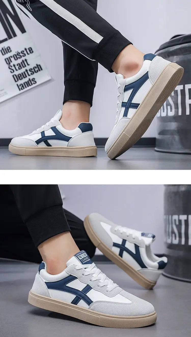 Sneakers décontractées pour hommes, chaussures de marche légères, en blanc et bleu marine, design bas (low-top) avec dessus en daim et en toile, et motif classique à rayures croisées.
