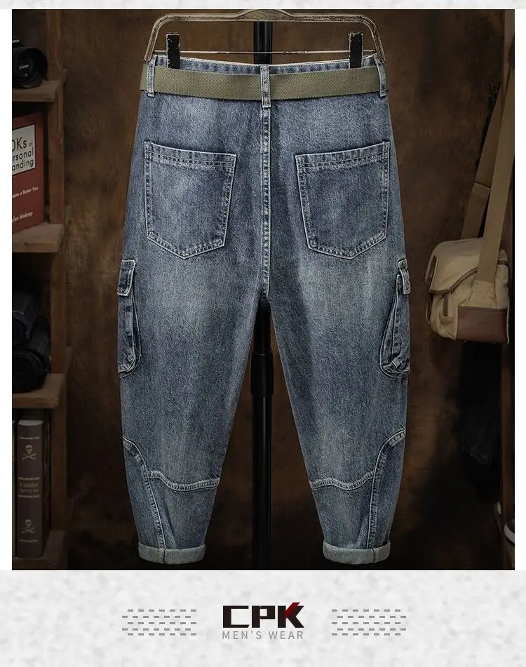 Men denim cargo jeans casual loose pants in light-wash denim with olive green elastic waistband and rolled cuffs.