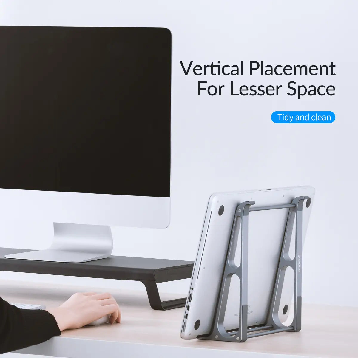 Silver metallic Orico portable aluminum laptop stand and desktop riser with minimalist design and adjustable support arms.