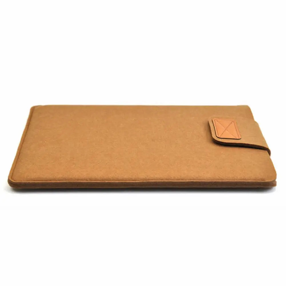 Tan felt laptop bag sleeve for MacBook Air with matching leather flap and stitched edge detailing suitable as a tablet bag.