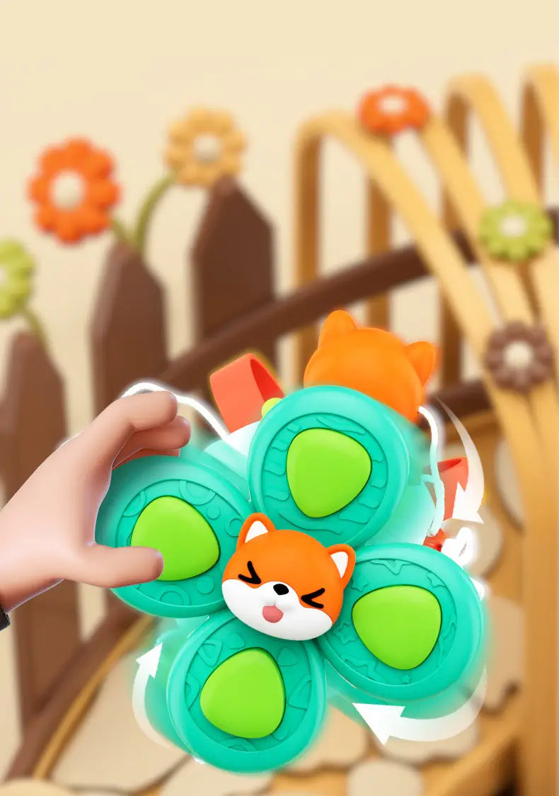 Jouet de voyage cube d’occupation Montessori en forme de fleur turquoise et verte, avec un visage de renard orange au centre, fabriqué en silicone souple, pour un jeu sensoriel.