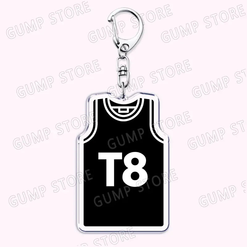 Black and white basketball jersey-themed Tate Mcrae acrylic keychain with silver-toned metal clip for music fan gift.