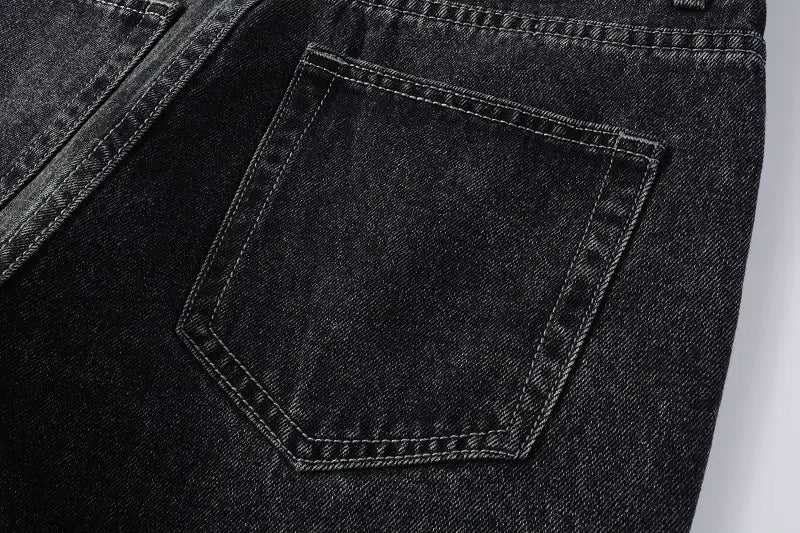 men flare jeans distressed dark gray denim trousers showing the back side with classic dark-wash denim jeans featuring a back pocket with contrasting stitching