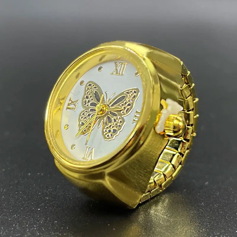 Gold-colored butterfly watch ring made of stainless steel featuring a white dial with roman numerals for cute jewelry use.