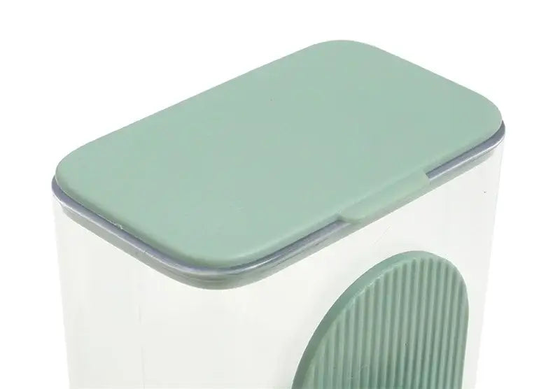 A sleek translucent white automatic pet feeder container with a matte sage green lid and textured side grip made of high-quality plastic for efficient food storage.