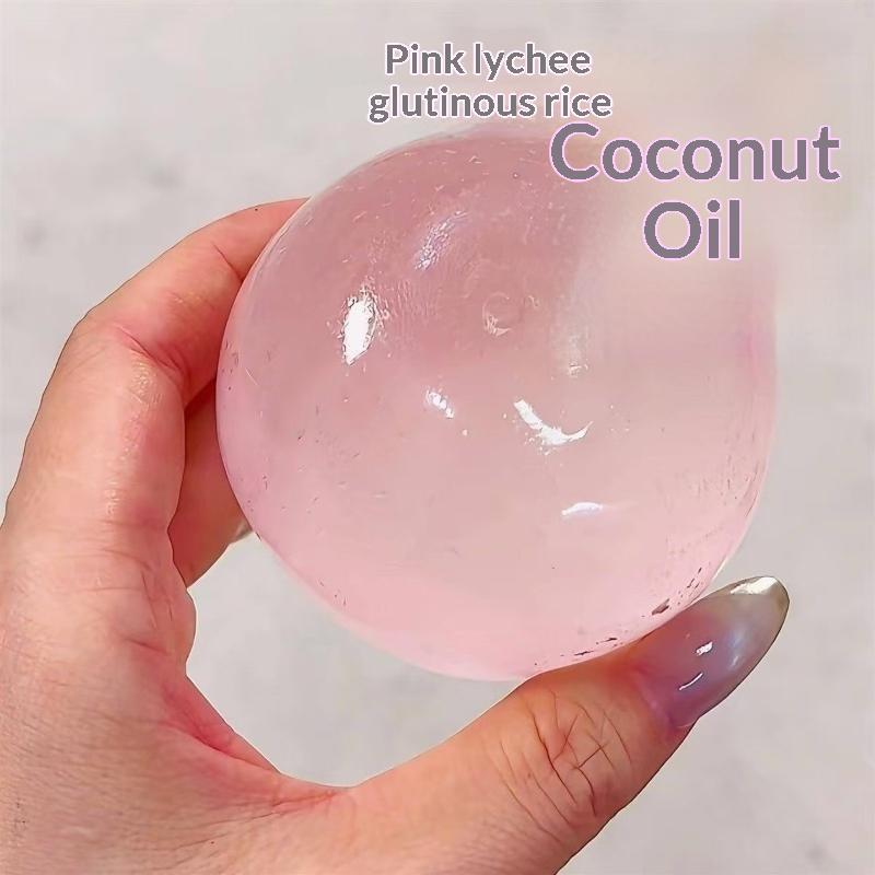 Eine transluzente rosafarbene gallertartige Kugel aus rosa Litschi-Glutinous-Reis und Kokosöl-TPR-Material, verwendet als Fidget-Spielzeug zur Stresslinderung, Kokosöl-Kugel.