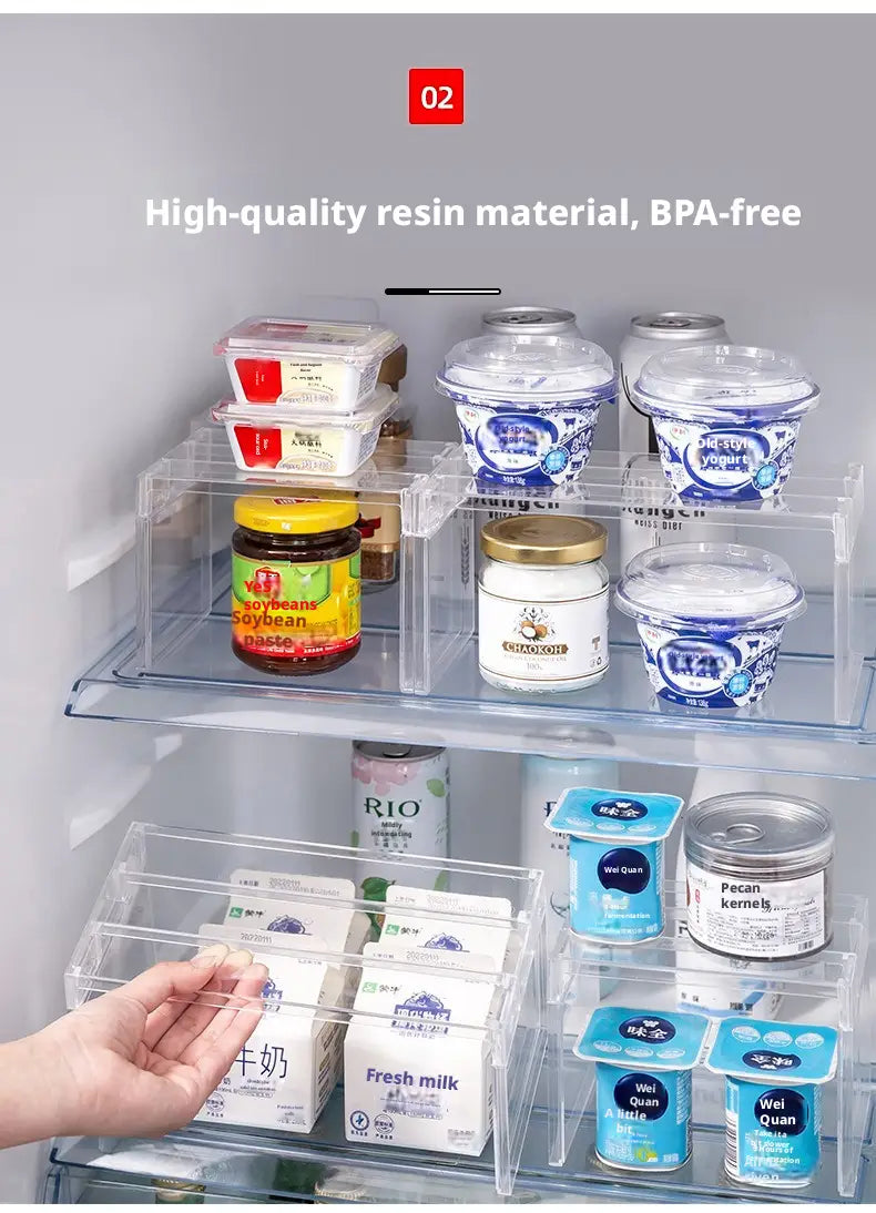 Clear expandable cabinet organizer and spice rack made of clear plastic with transparent compartments holding various dairy and food items.