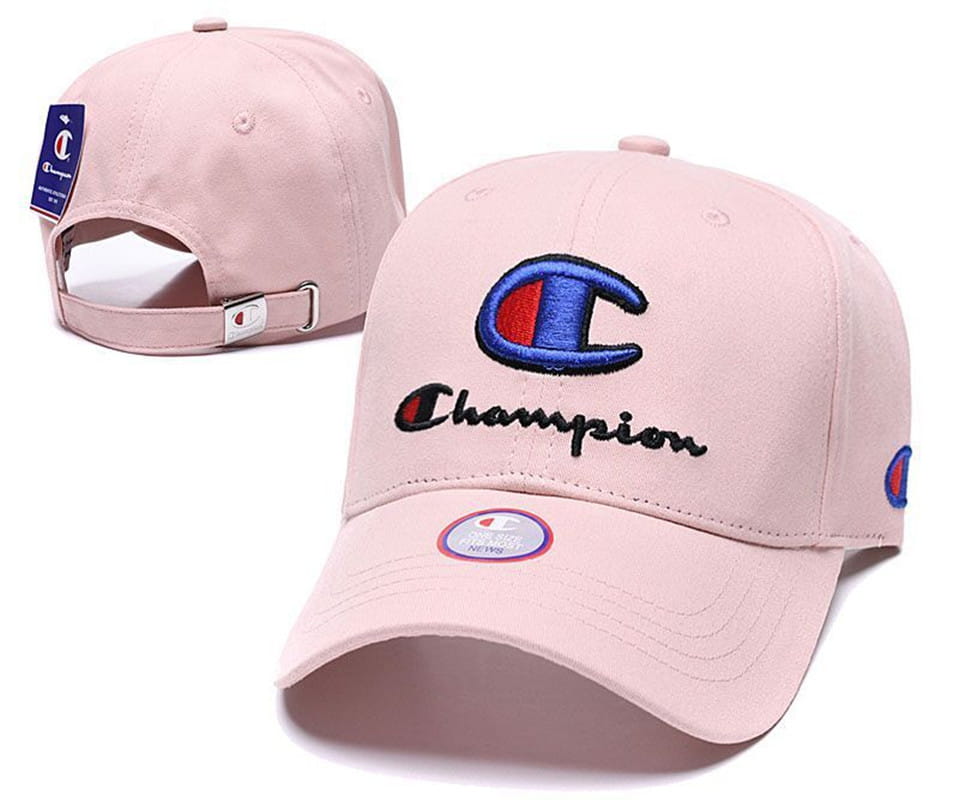 Pink Champion baseball cap featuring an embroidered blue and red logo, black script branding, and a matching brand tag on the back, designed as a unisex summer sun hat.