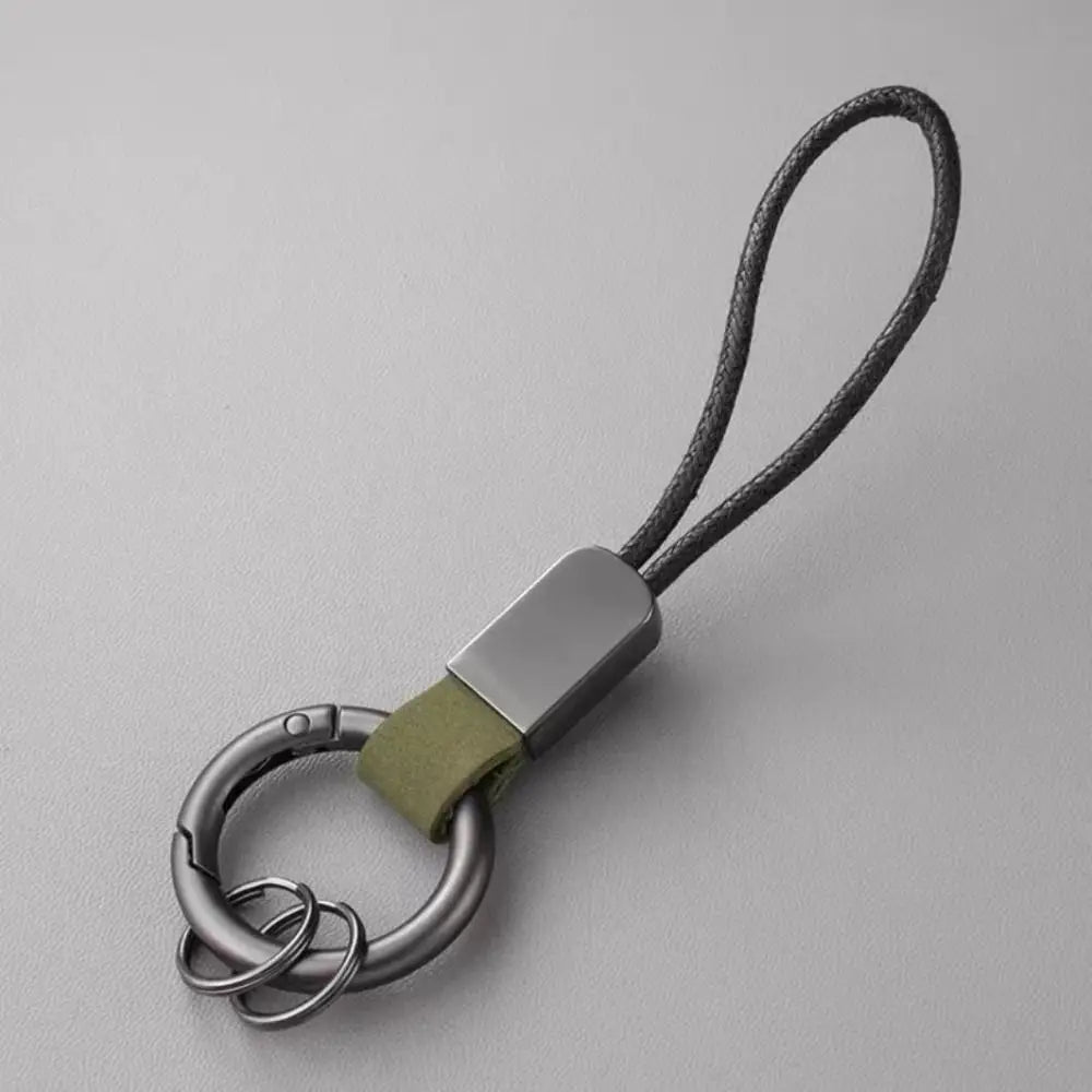 Leather carabinieri keychain anti-lost business key holder featuring a silver-toned metal key ring, sleek rectangular connector, olive green leather strap, and dark gray braided cord.