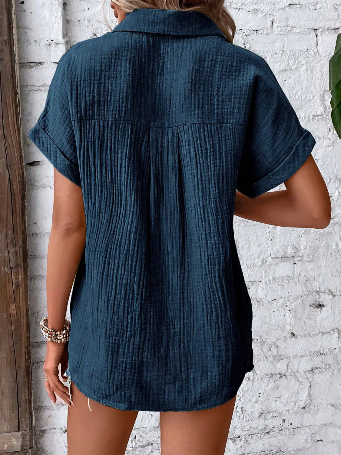 Dark teal women cotton short sleeve button up shirt dress with subtle textured fabric and collar.
