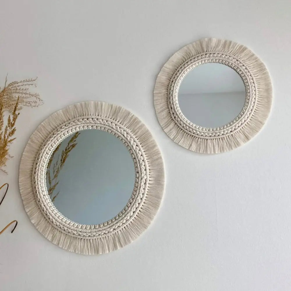 Cream-colored boho macrame wall mirror with fringed edges and braided detailing for living room home decor.