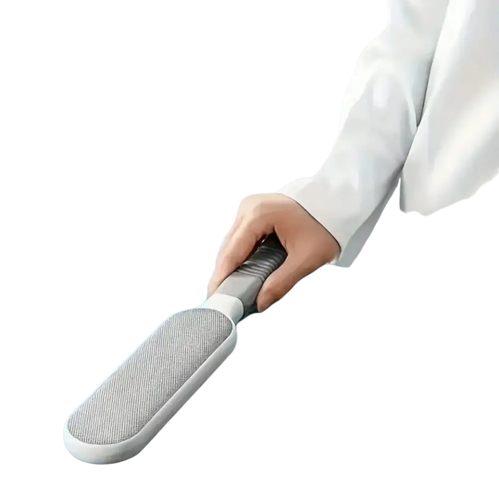 Gray and white double-sided pet hair remover with textured bristled head for manual hair ball and lint removal
