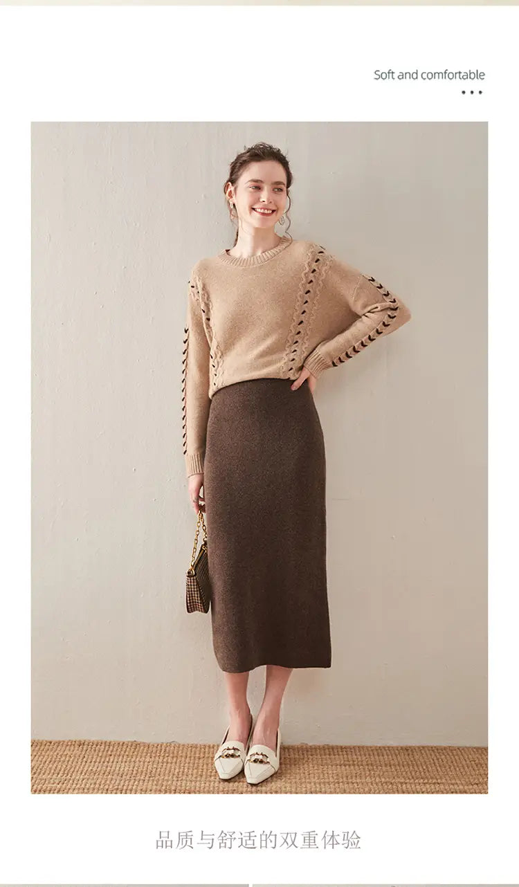 beige knitted sweater with black lace trim along the sleeves paired with a wool knit midi skirt high waisted pencil skirt.