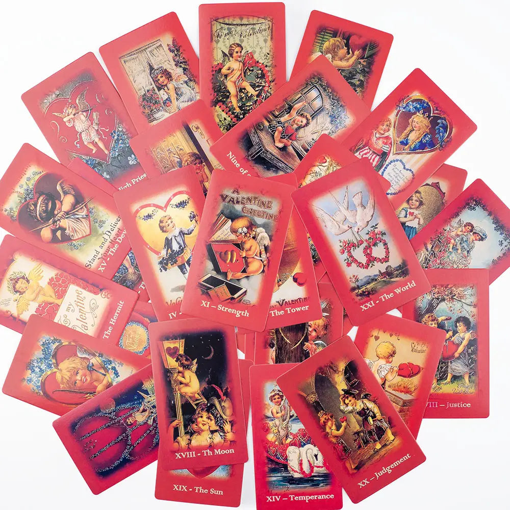 A set of vintage-style valentine tarot deck love oracle cards featuring red borders and illustrated scenes with cherubs hearts and romantic imagery.
