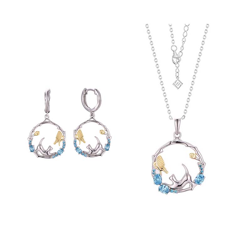 Silver and gold-toned circular pendant necklace with blue gemstone accents from the 925 silver cat zirconia jewelry set.