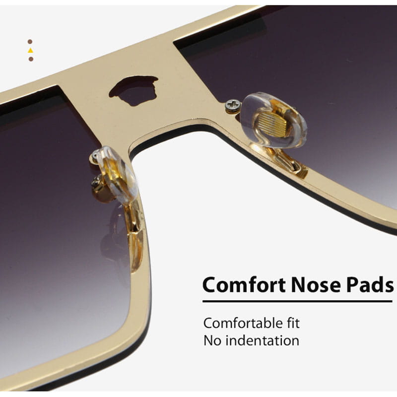 Polarized oversized metal sunglasses for adults featuring gold frames, dark gradient lenses, and clear cushioned nose pads.