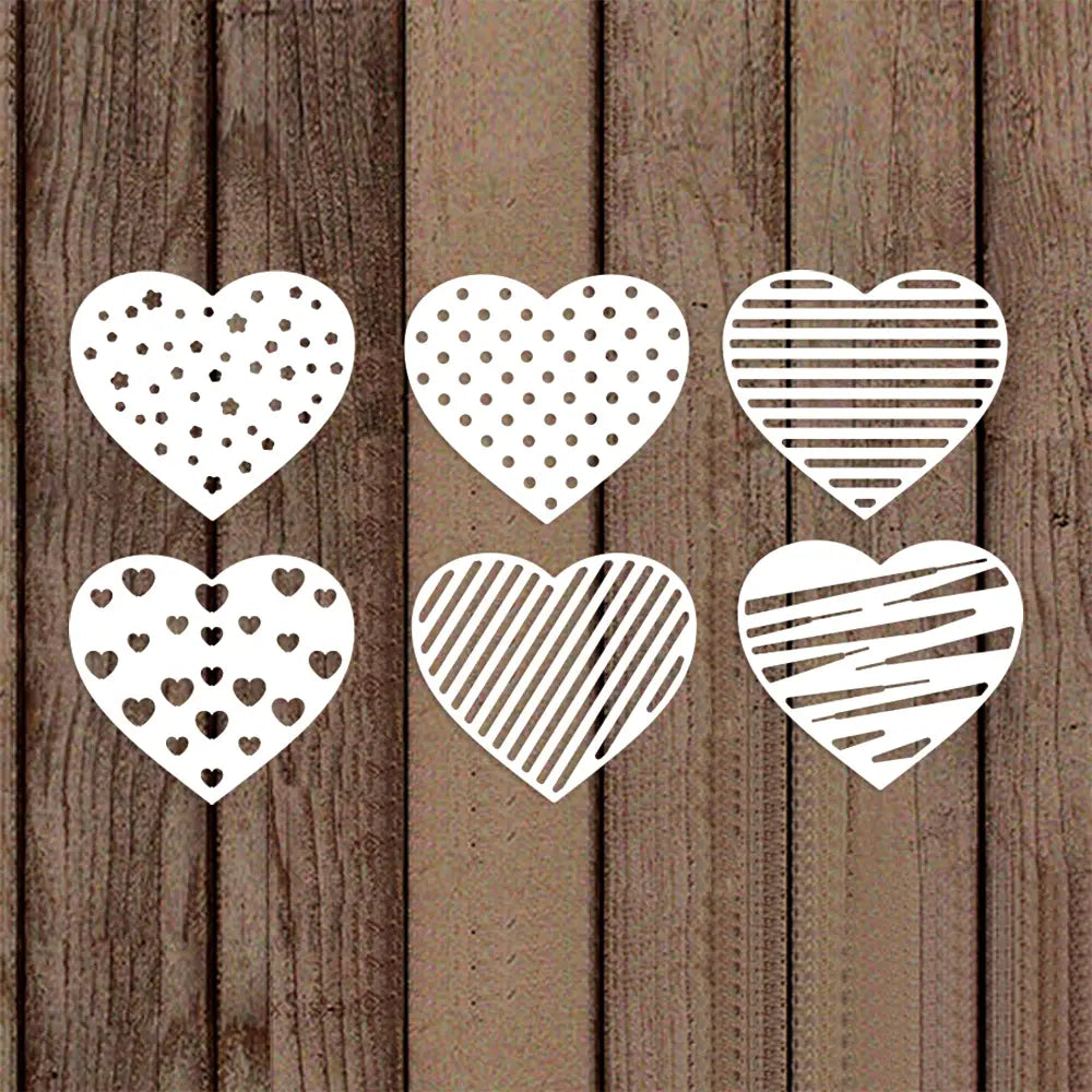 Set of six white metal cutting dies shaped like hearts with polka dots stripes and smaller heart patterns for Chinese New Year crafts.