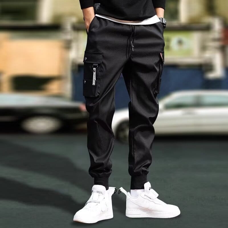 men tactical cargo pants in black with multiple pockets and a drawstring waistband made from durable fabric for versatile use