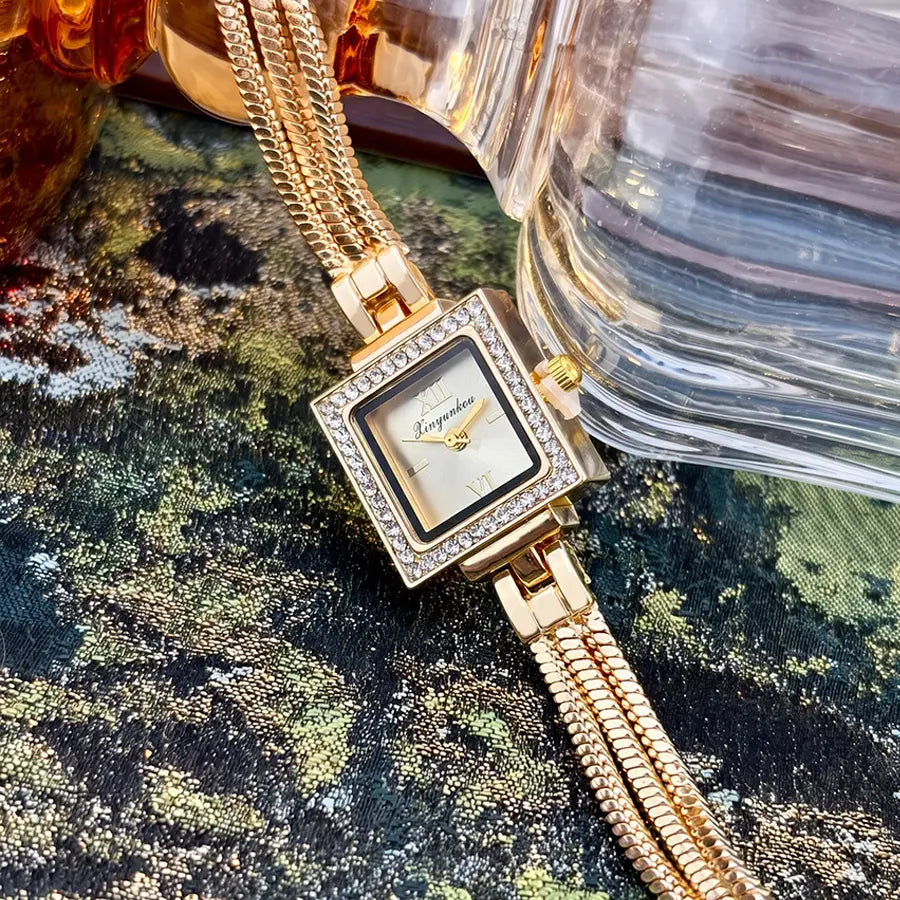 Gold-toned square watch with a diamond-encrusted bezel and matching braided chain strap from the Gold Diamond Square Watch Vintage Fringe Strap collection.