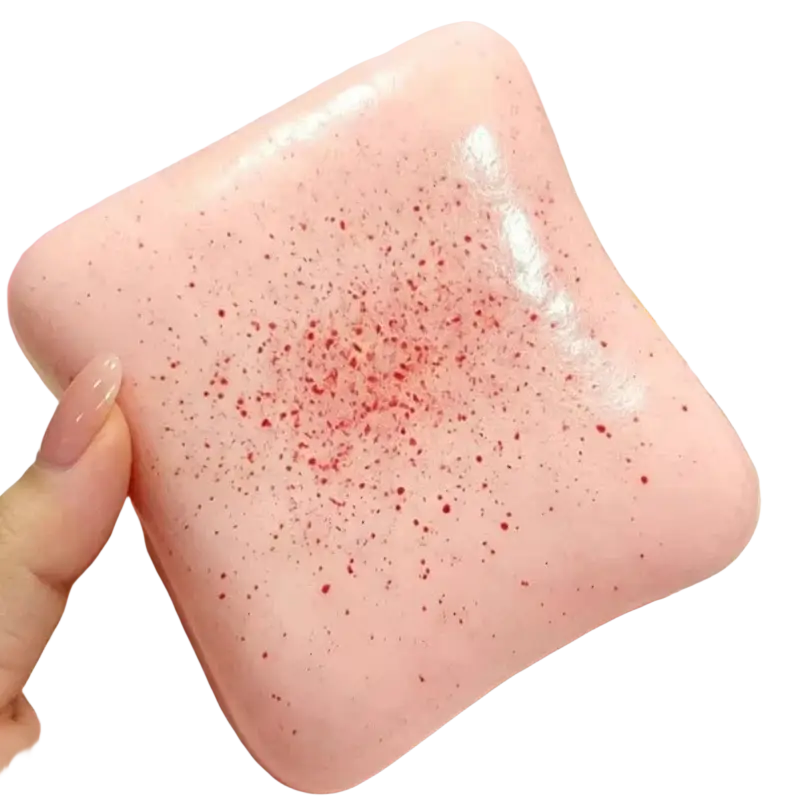 Pink square bread butter squishy with red speckles slow rising stress relief fidget toy for adults and parties