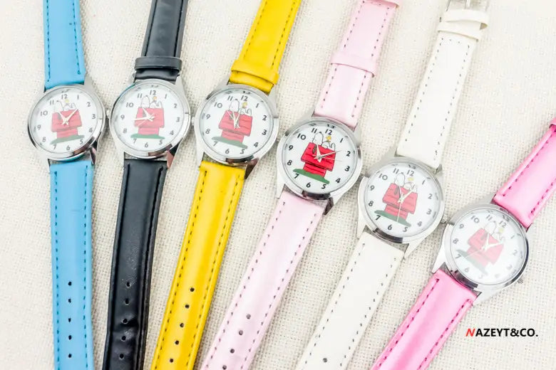 A collection of six colorful Snoopy quartz watches featuring cartoon designs on the leather wristbands in blue black yellow pink white and a second shade of pink.