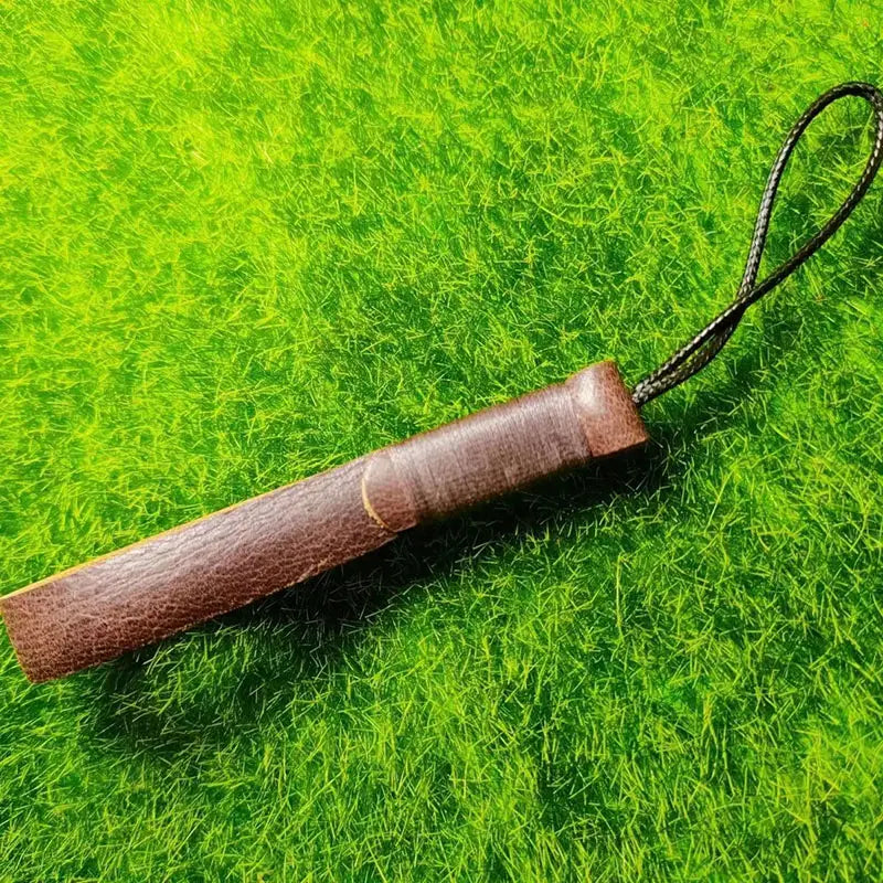 Brown leather-wrapped leather weave lanyard keychain car key holder with a black braided cord loop at one end.