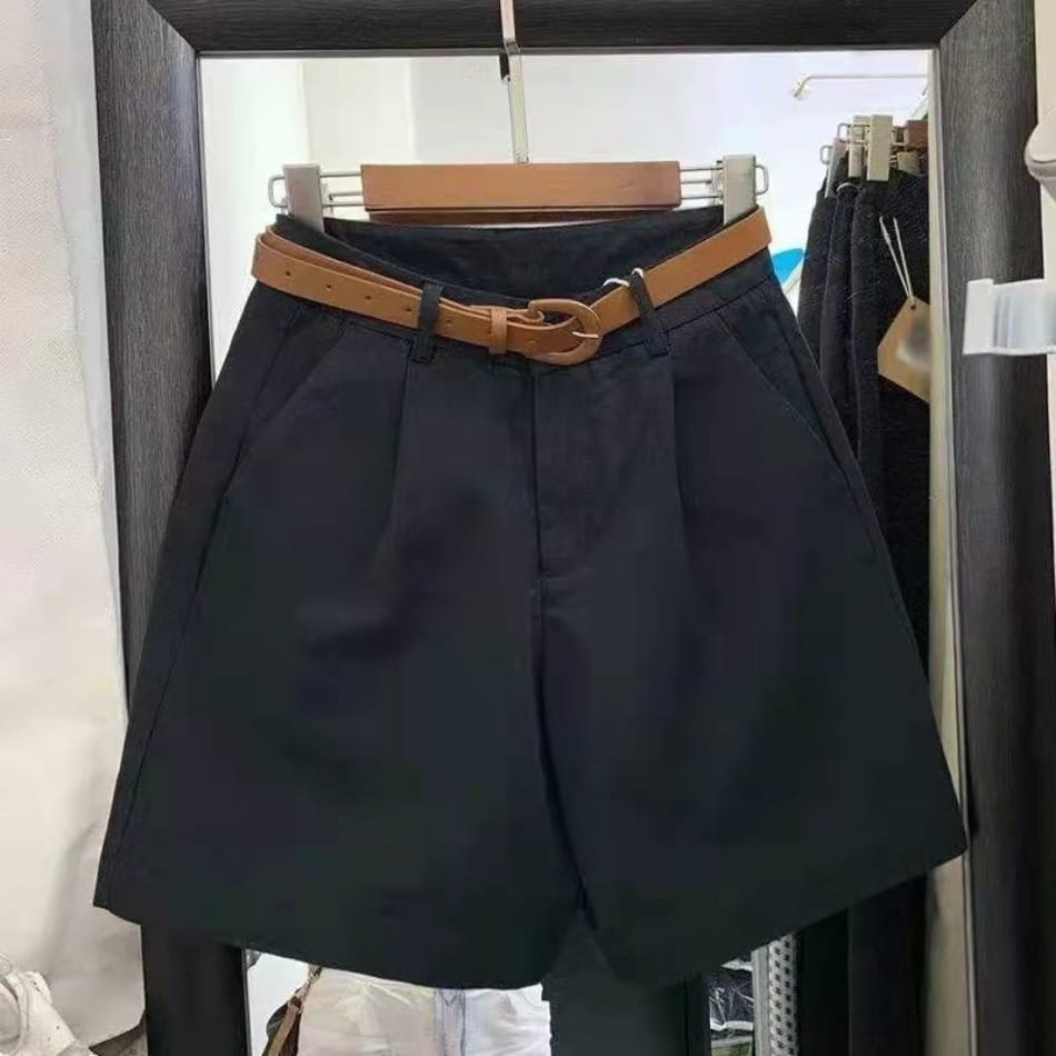 Black pleated wide leg summer shorts for women with a tan leather belt featuring a double loop buckle for casual wear.