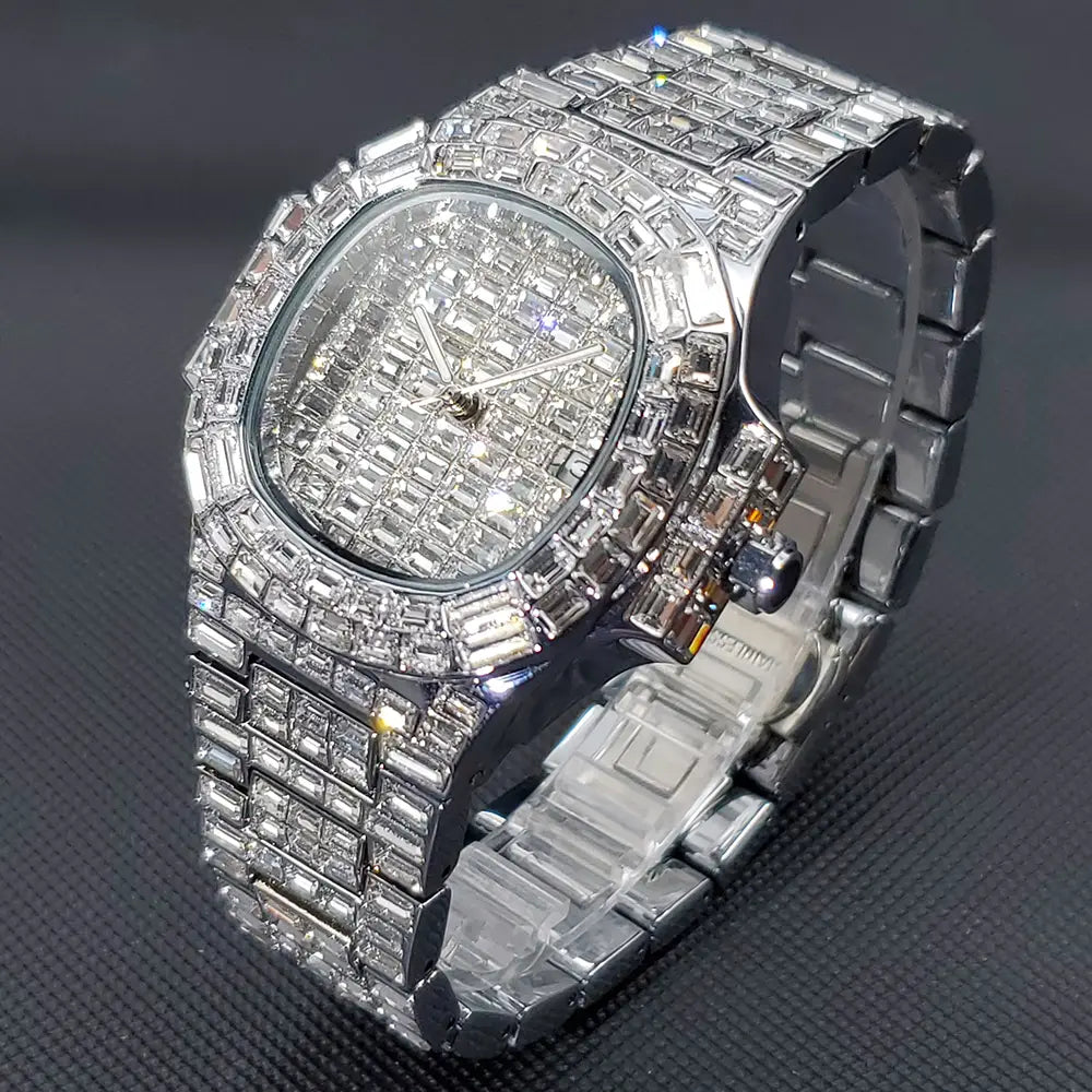 A dazzling silver stainless steel iced out diamond quartz watch for men with a rectangular face and band entirely encrusted in baguette-cut clear crystals.