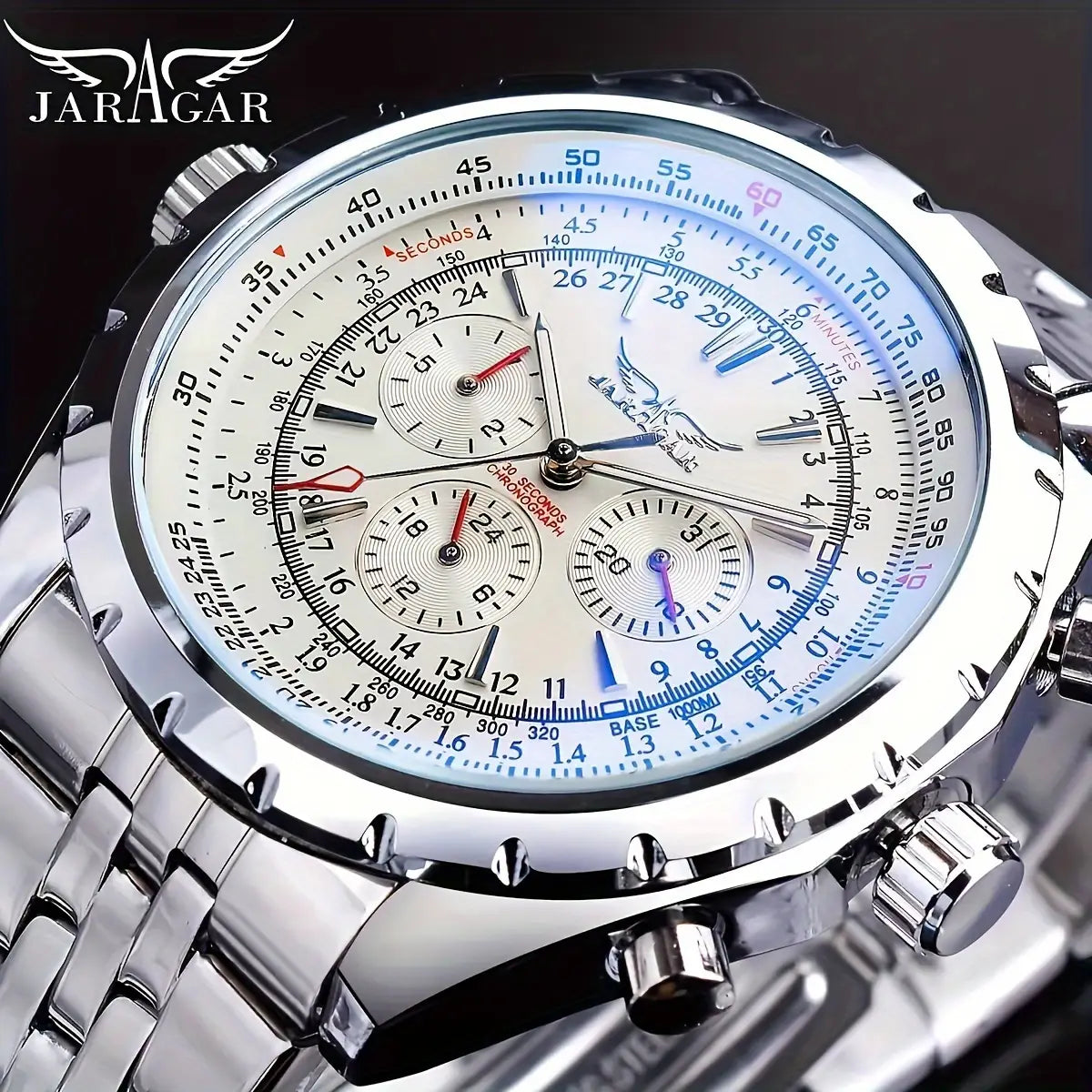 Mechanical stainless steel men’s chronograph watch featuring a silver Jaragar case with a white dial, blue and pink accents on the bezel, and three subdials.