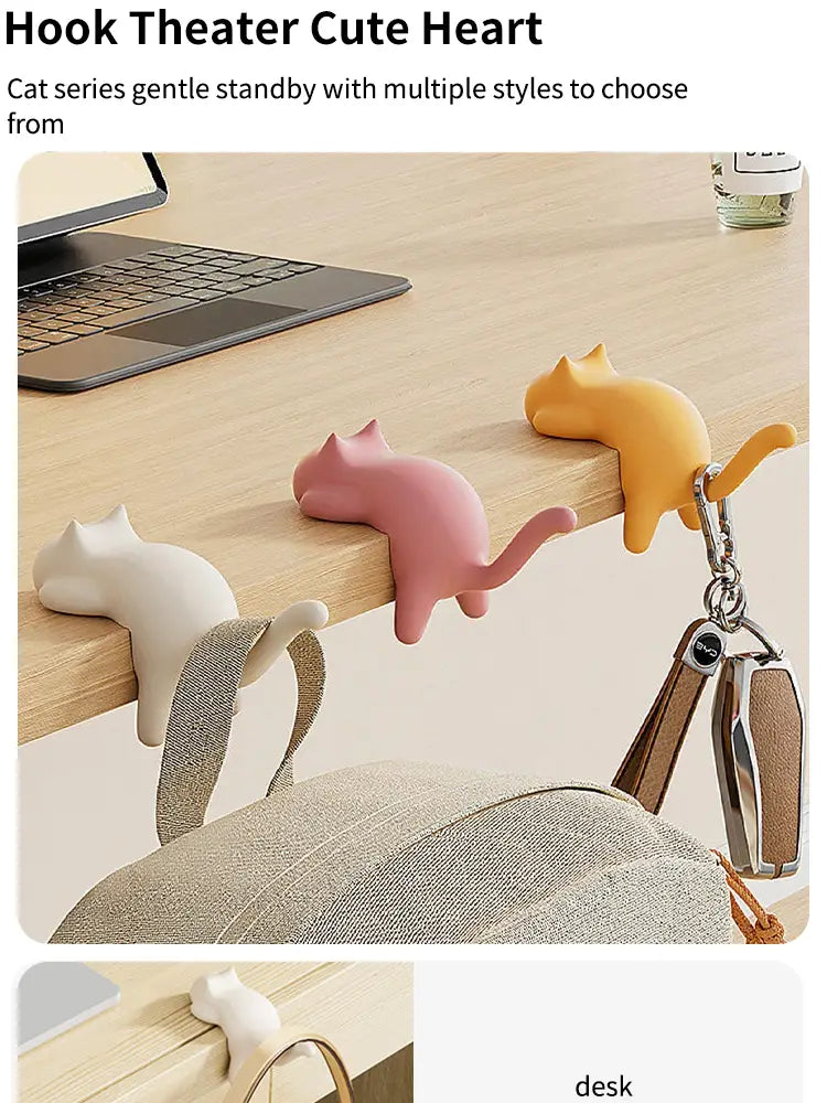 Cute cat-shaped desk hook silicone organizer in pastel pink yellow and white for office or home use.