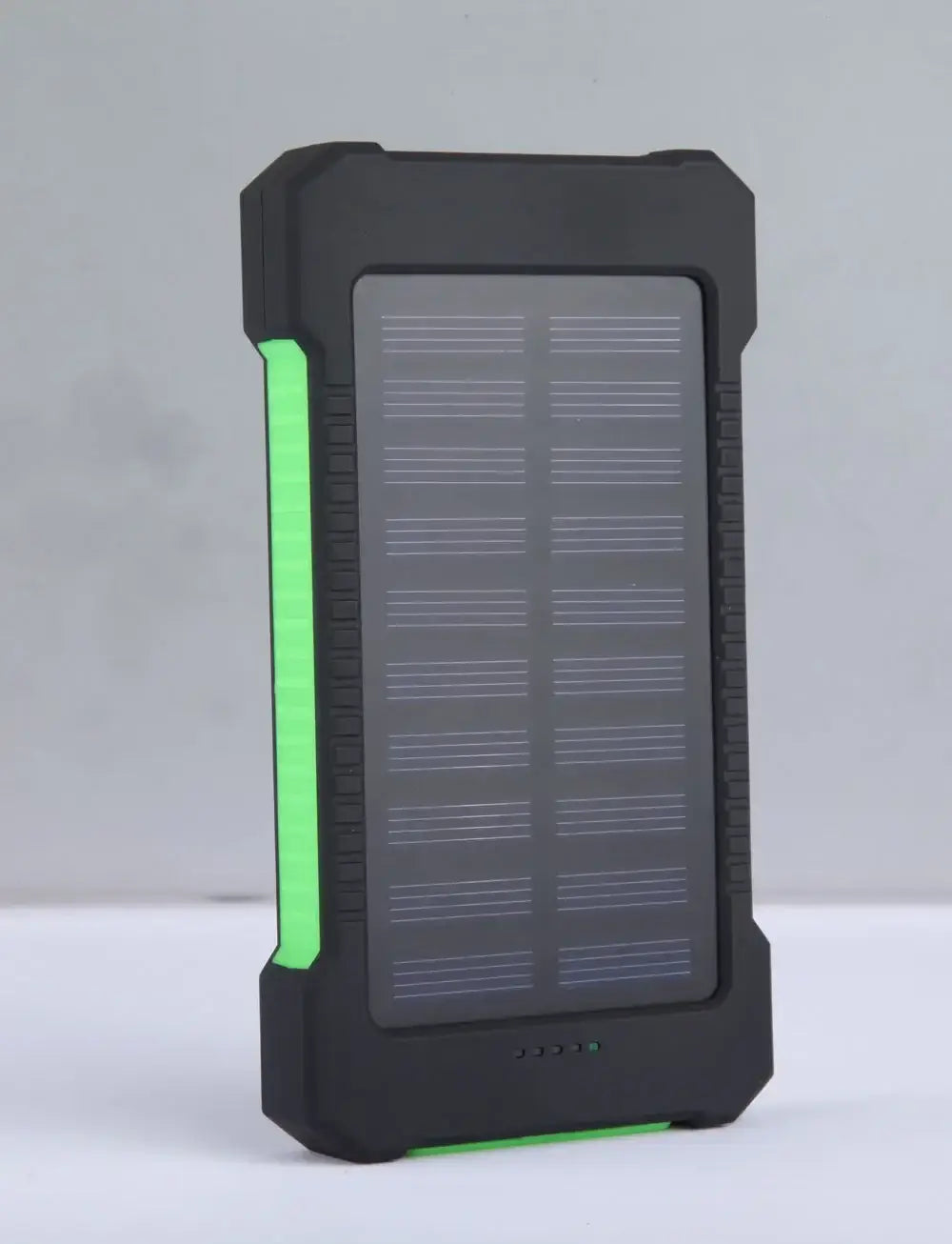 Black rugged 20000mah solar power bank with solar panel, dc5v dual USB ports, green LED accents, and textured grip for portable charging.