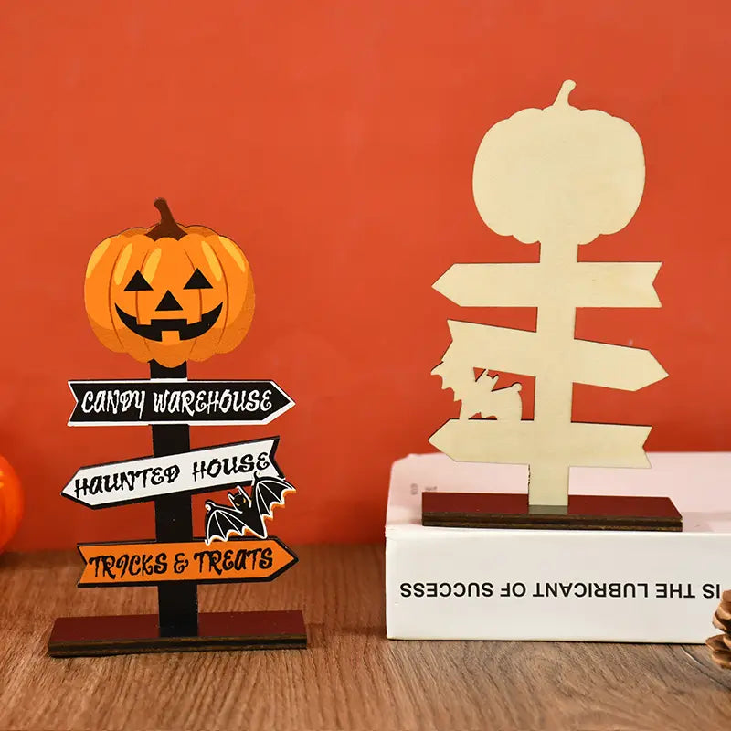 Wooden Halloween directional sign desktop decoration featuring an orange pumpkin shape with black text on white and orange arrows.