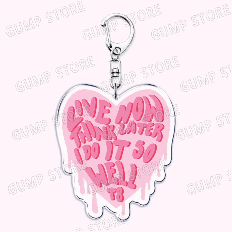 pink heart-shaped acrylic keychain with silver metal clasp featuring the phrase live now think later i do it so well t8 in matching pink lettering tate mcrae acrylic keychain music fan gift