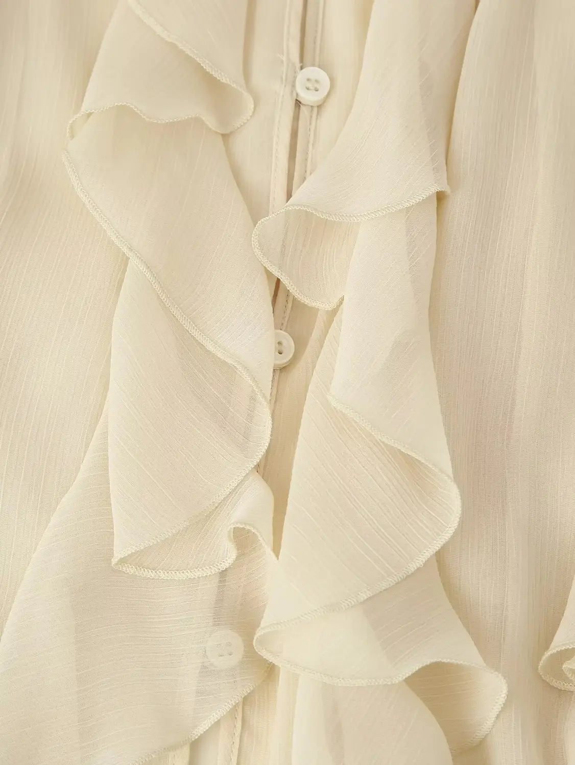 cream-colored chiffon blouse featuring delicate ruffled layers and matching buttons with long sleeve design ruffle shirt long sleeve v-neck style.