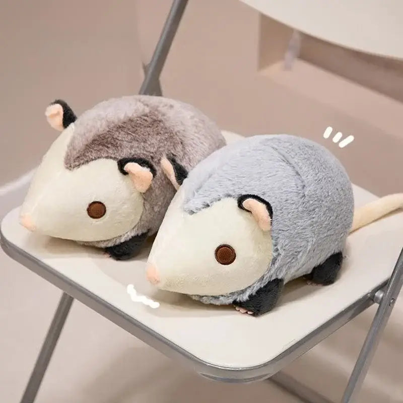 Two 30cm soft plush opossum stuffed animals in gray and white with black feet and brown eye and light blue and white with similar features.