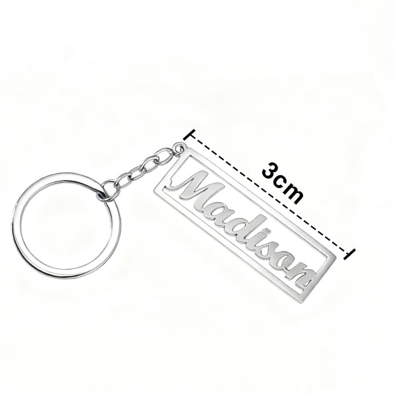Silver stainless steel rectangular keychain with the name Madison engraved in cursive on a polished metallic surface attached to a circular ring via a short chain.
