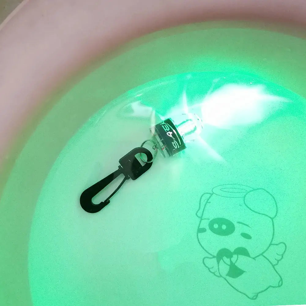 Black led keychain scuba diving water activated safety led beacon with glowing green light and carabiner clip.