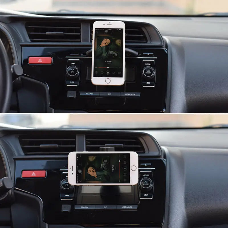 white smartphone mounted in a black magnetic cd slot mini car phone mount holder for gps and iphone use