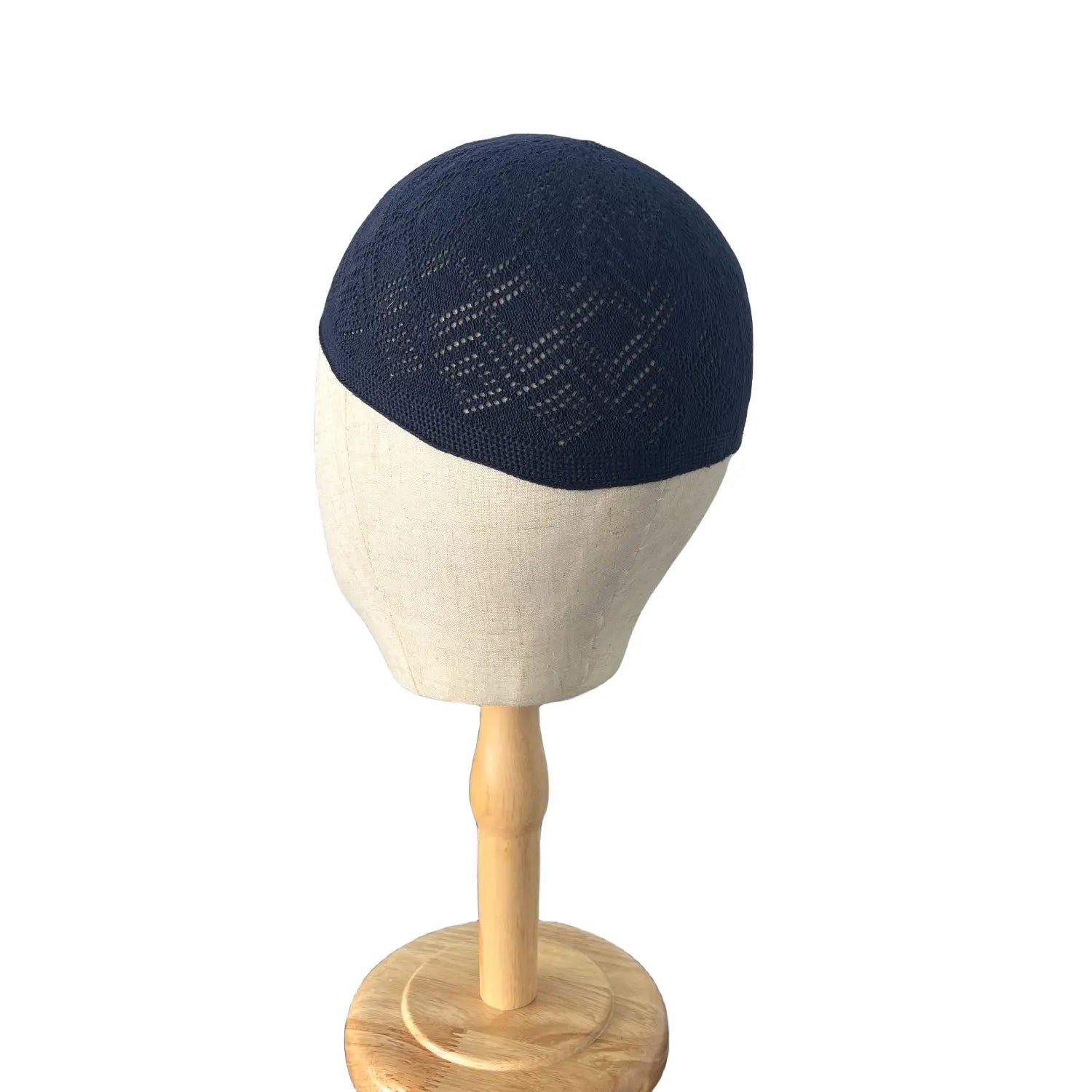 Navy blue knitted kufi beanie prayer cap featuring a subtle geometric pattern.