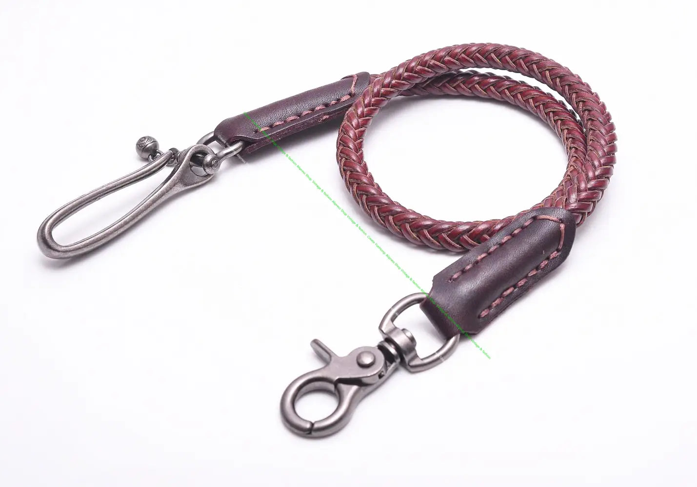 A braided burgundy leather biker wallet chain with dark brown stitched ends and silver toned metal clasps designed as a punk jeans accessory.