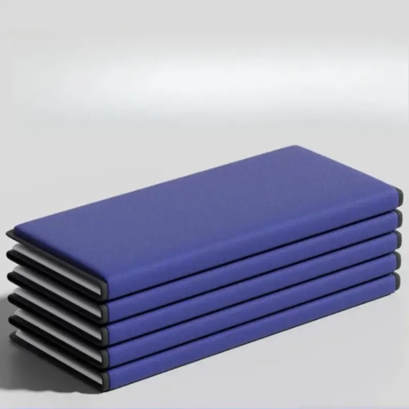 Stack of five royal blue hardcover notebooks with black edges and white pages highlighting product selling points for inflatable outdoor garden bed cotton patio lounge furniture.