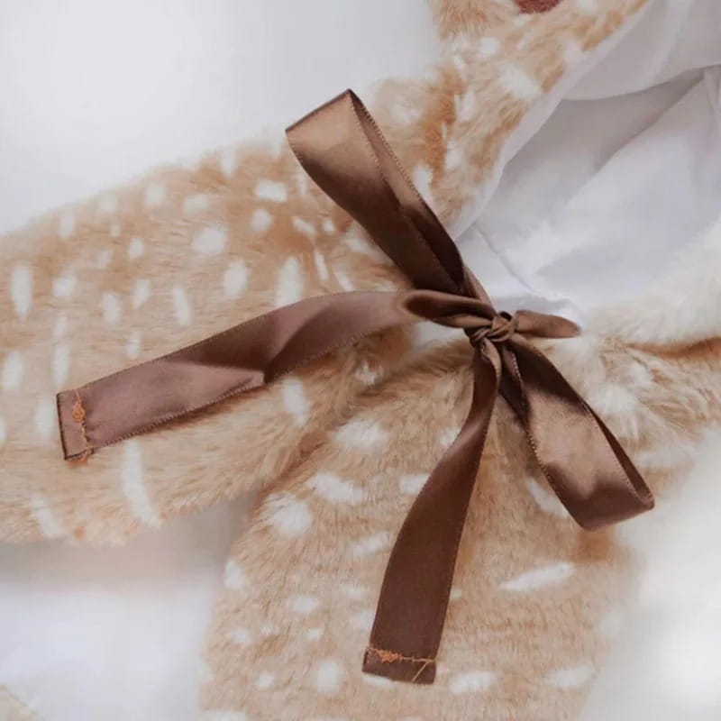 a glossy brown satin ribbon tied into a neat bow on pet dog clothes reindeer winter costume designed for dogs