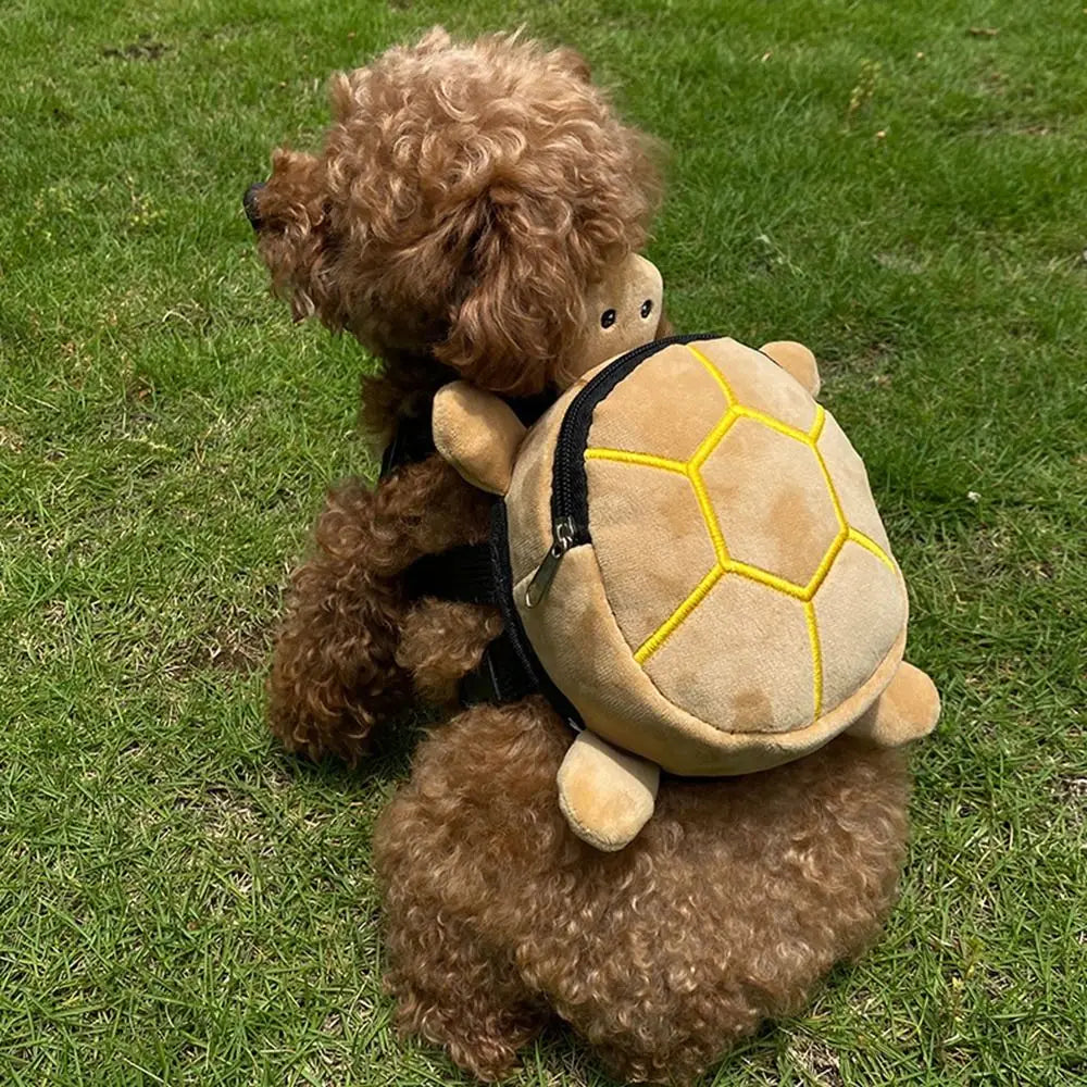 A plush tan turtle shape dog backpack with yellow stitching and a black zipper designed as a pet carrier.