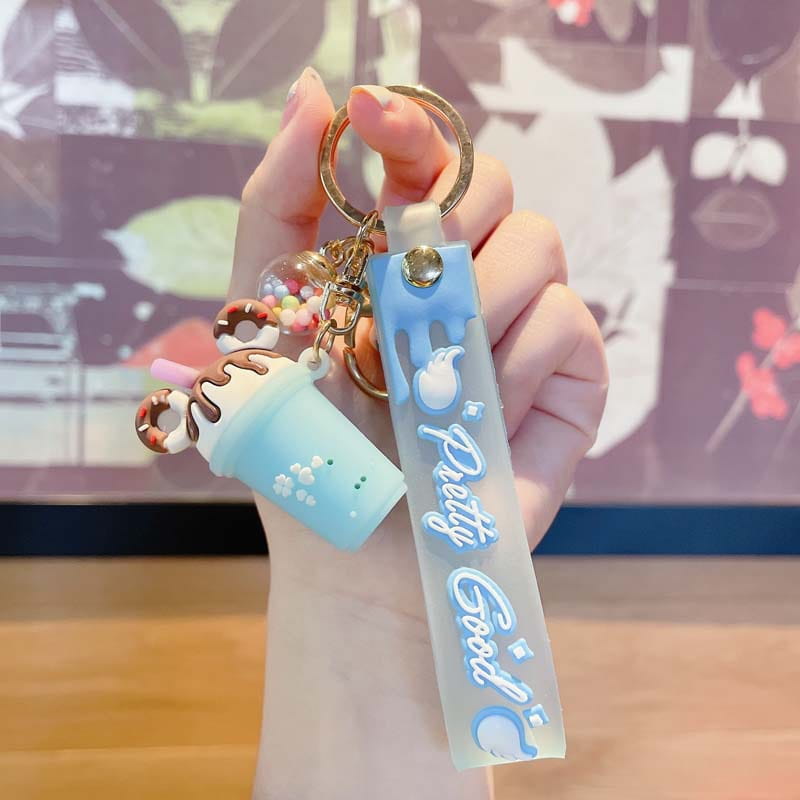 Light blue silicone ice cream keychain personalized pvc hanger with pretty good text and boba tea cup charm.