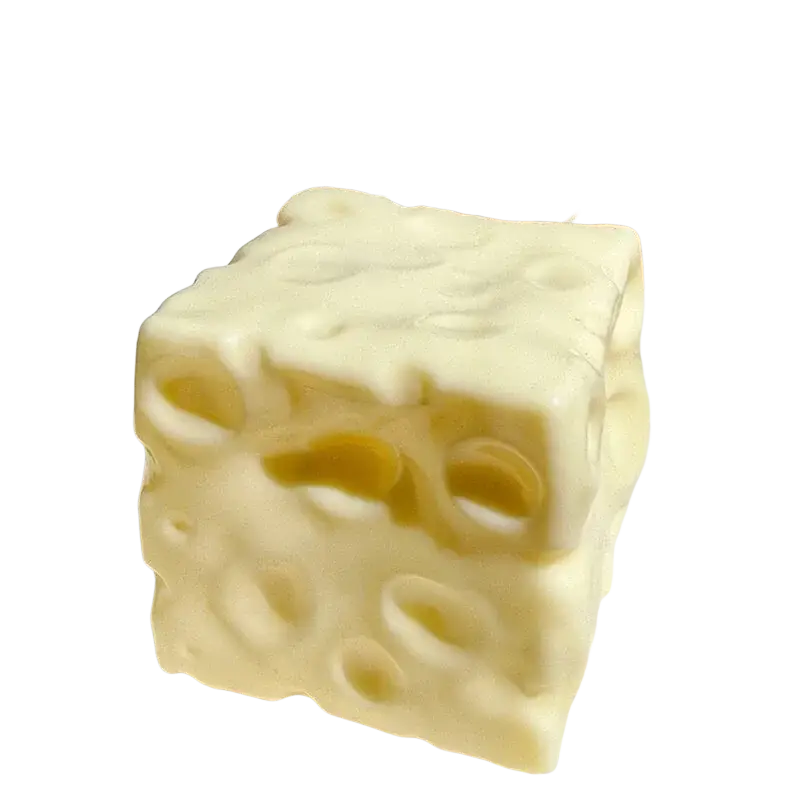 A creamy off-white cube-shaped stress relief cheese squishy toy with a swiss cheese pattern and textured surface