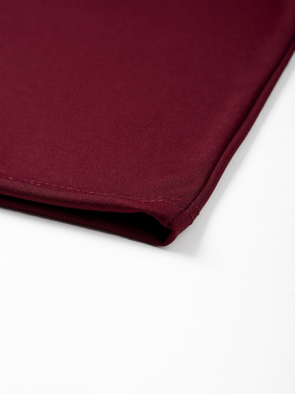 a rich burgundy satin napkin with neatly stitched edges complementing the mens raglan long sleeve casual t-shirt product imagery