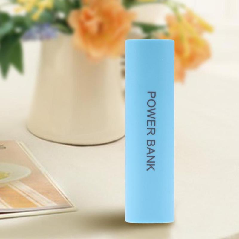 Light blue cylindrical portable 18650 power bank case diy shell charger with power bank printed vertically in black text.
