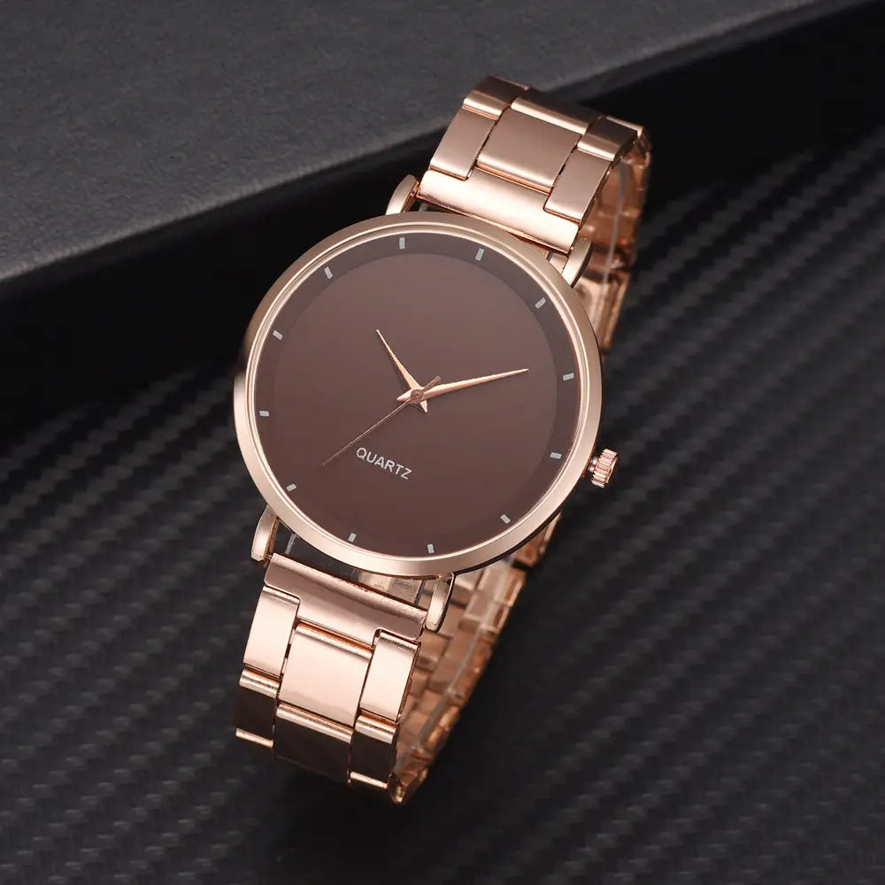 Rose gold women luxury watch quartz business wristwatch with a sleek minimalist design featuring a dark brown dial and matching metal bracelet.