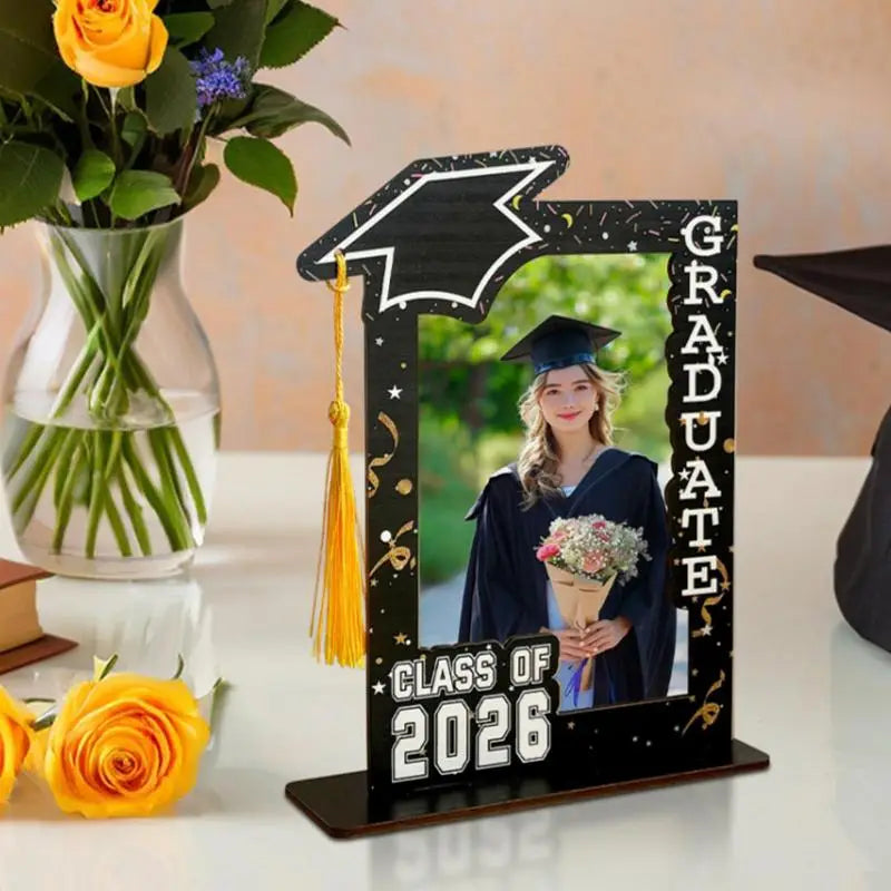 Class of 2026 wooden graduation photo frame in black with a gold tassel and graduate text for displaying graduation pictures.